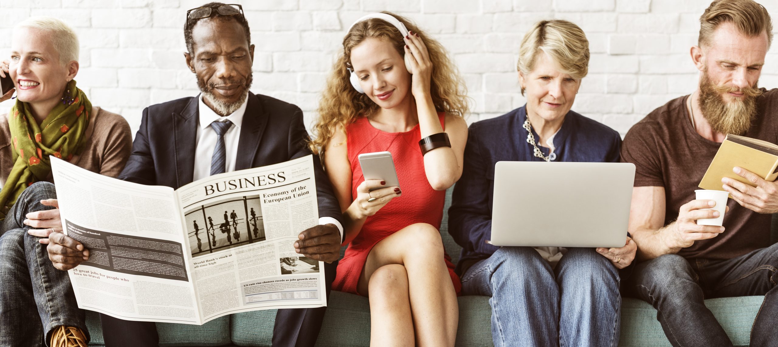 a group of people looking at adverts